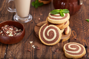 Two colored delicious homemade cookies with vanilla and chocolate flavor in a shape of spiral.  
