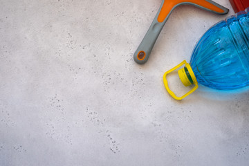 Hand cleaning a car windshield with window cleaner wiper. Washing car front windshield glass.