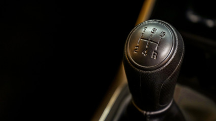 Close up of the gear shift lever of the car