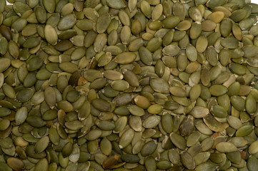 Sees background of pumpkin seeds. Food background. Top view of pumpkin seeds