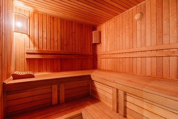Fototapeta na wymiar sauna bathhouse warm interior inside empty brooms barrels bucket for water
