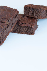 Vegan brownies chocolate plant based diet no animal products on dark background
