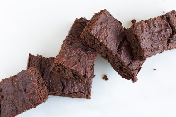 Vegan brownies chocolate plant based diet no animal products on dark background