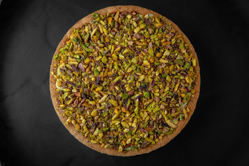 Classic gentle cheesecake with pistachios. Chic dessert.
