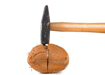 hammer and broken coconut on a white background