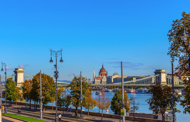 The famous bridge on the Danube River in Budapest against the background of the Hungarian Parliament