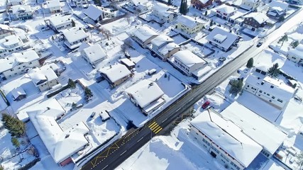 Aerial photography of beautiful towns and streets at the foot of the Swiss Alps in winter morning - Powered by Adobe