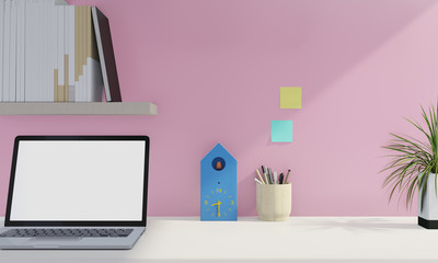 Notebook white screen in home office table and Pink wall background. Work from home concept.