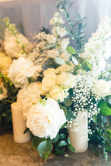Wedding decorations. Floristic composition of white flowers and greenery
