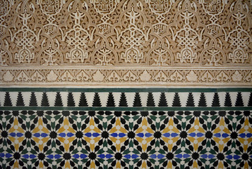 ornaments with tiles and stucco on a wall in Alhambra, Andalusien