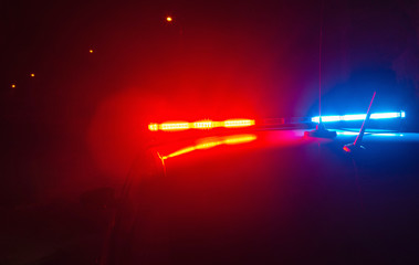 Police car flashing lights at dark night, crime scene, night patrolling the city, fight against...