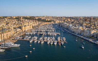 Aerial top view of Birgu city - one of three cities landmark on Malta country. Marina bay, yachts,...