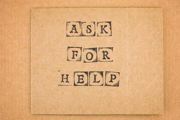 Cardboard with words Ask for Help