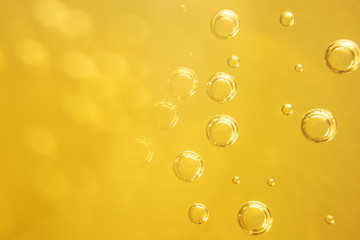 Carbonated drink close-up. Beer, lemonade. Detailed closeup. Bubbles in a liquid.