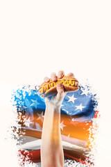 classic american hot dog in hand on american flag background