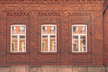 Fototapeta na wymiar Beautifully located windows of Helsinki houses