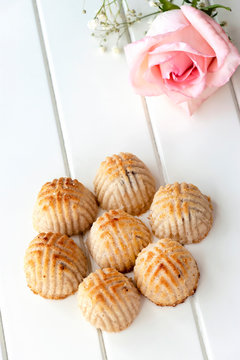 Maamoul traditional arab filled pastry or cookie with dates or cashew or walnut or almond or pistachios nuts. Eastern sweets. Close up. White wooden background Ramadan concept.