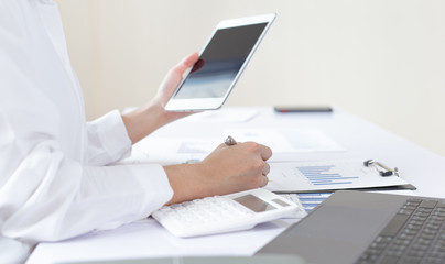 Financial business people are analyzing and examining Revenue - expense of real estate of the company, Financial and tax systems concept.