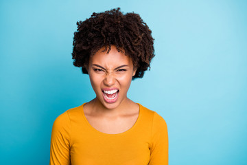 Portrait of outraged angry frustrated afro american girl have misunderstanding with her boyfriend scream loudly voice wear style stylish trendy jumper isolated over blue color background