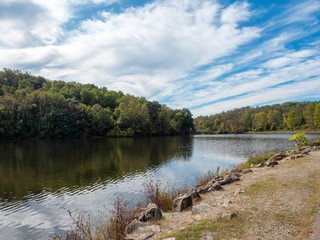 Twin Lakes in the Laurel Highlands of Pennsylvania.  Water with a trail along the side, a green tree line and bright blue and cloudy skies!  Nature landscapes, no person beauty!