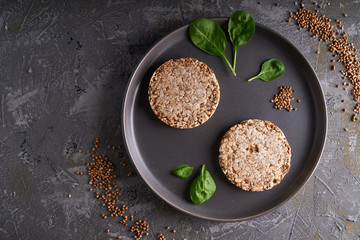 healthy buckwheat crispbreads on a dark background Copy space