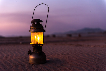  lamp on the sand  at the beach, romantic sunset