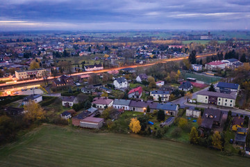 Drone view with railroad station and houses in Rogow village, Lodzkie Province of Poland