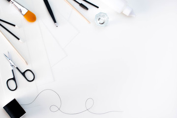 Brow and lash products in a flat lay style with a white background