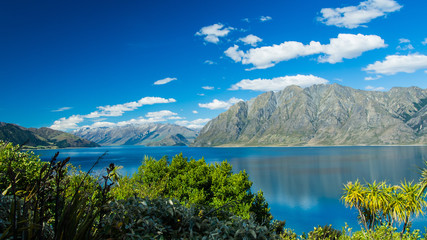 Naklejka na ściany i meble The blue lake with mountains, New Zealand