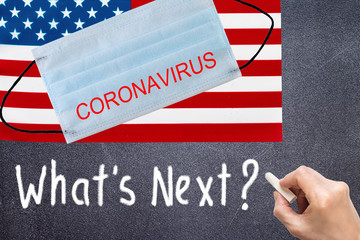 USA flag with disposable mask and CORONAVIRUS inscription. COVID-19 coronavirus epidemic in the United States of America. Global COVID-19 coronavirus pandemic