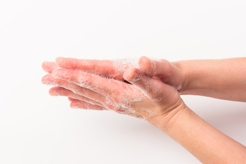 Fototapeta premium Closeup of woman washing hands isolated. Cleanliness and body care concept. Global Handwashing Day Concept/Washing hands with soap