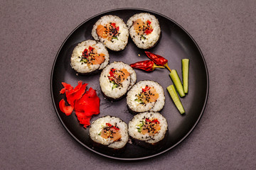 Korean roll Gimbap(kimbob). Steamed white rice (bap) and various other ingredients. Trendy black background