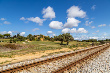 Obraz premium Train railway near golf course 