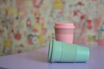 
Two reusable plastic coffee cups