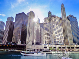 Ferry Boat on Chicago River Surrounded by Skyscrapers in Downtown Chicago on a Sunny Morning - Chicago, Illinois, USA