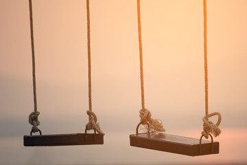 Children swing in the park