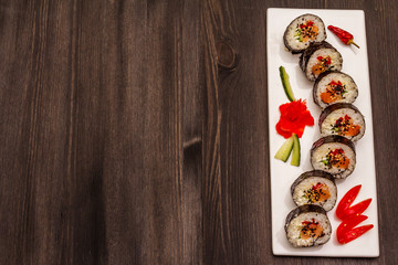 Korean roll Gimbap(kimbob). Steamed white rice (bap) and various other ingredients. Trendy black background