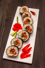 Korean roll Gimbap(kimbob). Steamed white rice (bap) and various other ingredients. Trendy black background