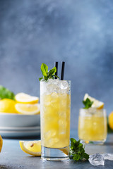 Fresh summer cocktail with lemons