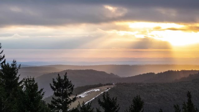 Time-lapse, Sunbeam, golden sunlight through clouds on hillsides, Baden, Germany