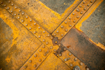 Rusty nut at the surface of steel plate closeup