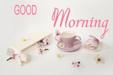 beautiful tender flat still life, card on a beige background for mother's day, magnolia buds, cup of cappuccino, concept of floral spring background