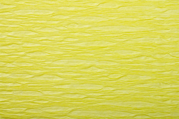 Background of yellow pressed corrugated paper with a horizontal texture taken close up