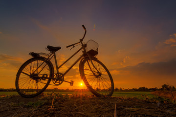 Fototapeta na wymiar beautiful bicycles silhouettel sunset background