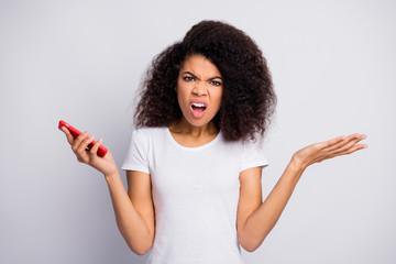 Close-up portrait of her she nice attractive lovely outraged irritated ignorant wavy-haired girl using gadget smm fake news browsing isolated over light white pastel color background