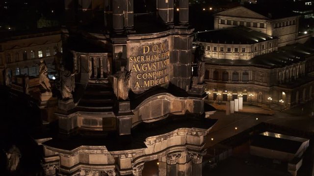 drone flight by night over the historic city of Dresden with the opera house Zwinger and the church dresden kreuzkirche