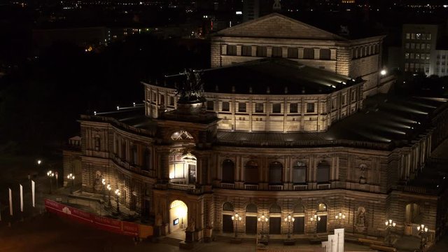 drone flight by night over the historic city of Dresden with the opera house Zwinger and the church dresden kreuzkirche