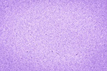Texture of light lilac rough paper with fibers. Eco-recycled kraft paper. Cardboard background.