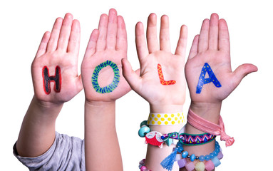 Kids Hands Holding Colorful Spanish Word Hola Means Hello. White Isolated Background © Nelos