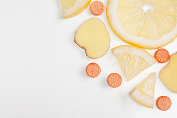 Sliced lemon with ginger and copy space